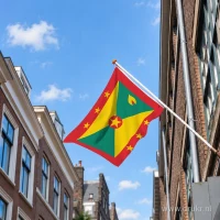 Vlag van Grenada aan een gevelstok